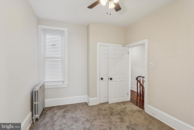 2518 N 12th St, Philadelphia, PA 19133 - unfurnished bedroom with radiator, baseboards, a closet, and carpet floors