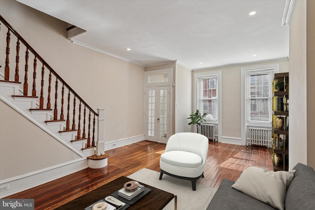 2518 N 12th St, Philadelphia, PA 19133 - living room with radiator heating unit, crown molding, french doors, and hardwood / wood-style flooring