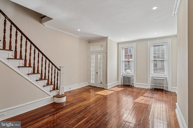 2518 N 12th St, Philadelphia, PA 19133 - foyer entrance with ornamental molding, radiator heating unit, hardwood / wood-style floors, and stairway