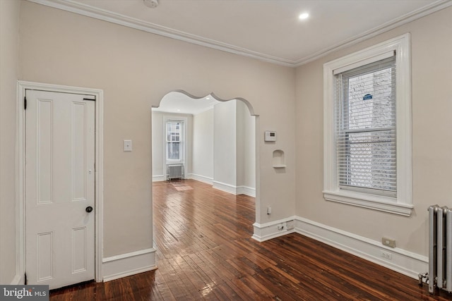 2518 N 12th St, Philadelphia, PA 19133 - interior space with ornamental molding, baseboards, radiator heating unit, arched walkways, and dark wood finished floors