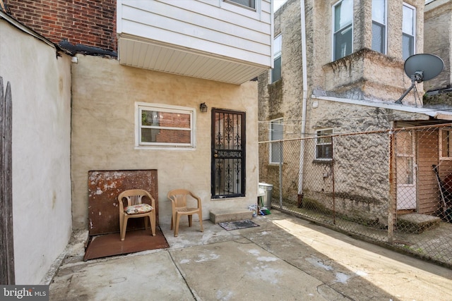 2518 N 12th St, Philadelphia, PA 19133 - view of exterior entry featuring fence and a patio area