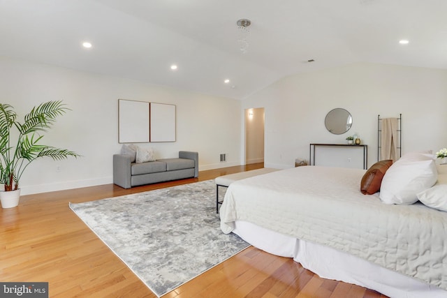 bedroom featuring recessed lighting, baseboards, light wood-style flooring, and lofted ceiling