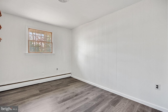 24 Elk Rd, Mullica Hill, NJ 08062 - spare room with baseboards, baseboard heating, and wood finished floors