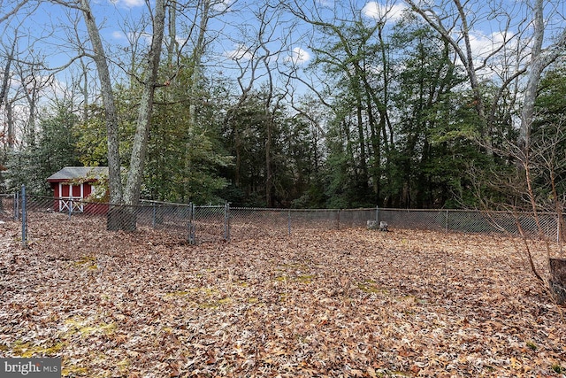 24 Elk Rd, Mullica Hill, NJ 08062 - view of yard with a fenced backyard and a wooded view