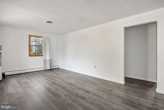 24 Elk Rd, Mullica Hill, NJ 08062 - spare room featuring baseboards, a baseboard radiator, dark wood-style floors, and visible vents