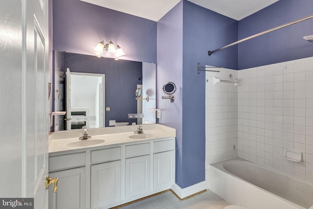 8716 Salinas Ct, Odenton, MD 21113 - full bathroom featuring ensuite bath, tile patterned flooring, shower / bath combination, double vanity, and baseboards