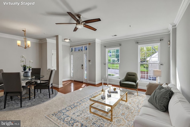 8716 Salinas Ct, Odenton, MD 21113 - living room featuring a ceiling fan, crown molding, a chandelier, baseboards, and wood finished floors