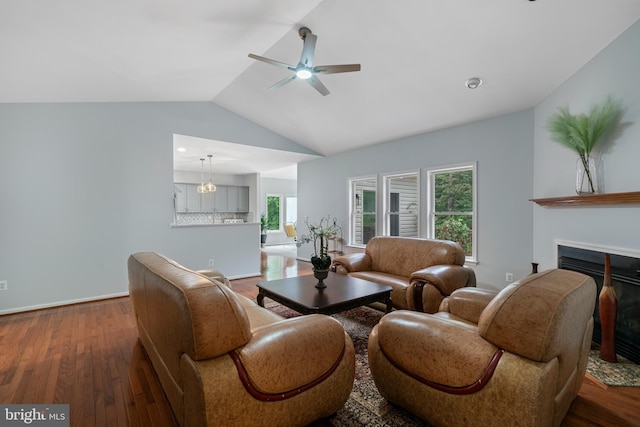 13647 Van Doren Rd, Manassas, VA 20112 - living area featuring ceiling fan, wood finished floors, vaulted ceiling, a glass covered fireplace, and plenty of natural light