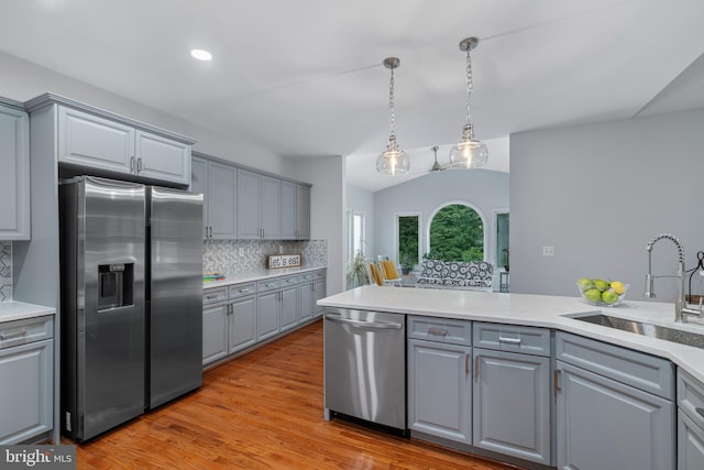13647 Van Doren Rd, Manassas, VA 20112 - kitchen with appliances with stainless steel finishes, gray cabinets, a sink, vaulted ceiling, and recessed lighting