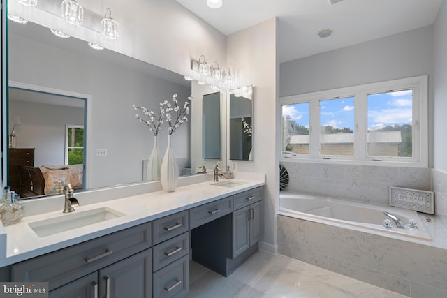13647 Van Doren Rd, Manassas, VA 20112 - full bathroom featuring a bath, double vanity, and marble finish floors