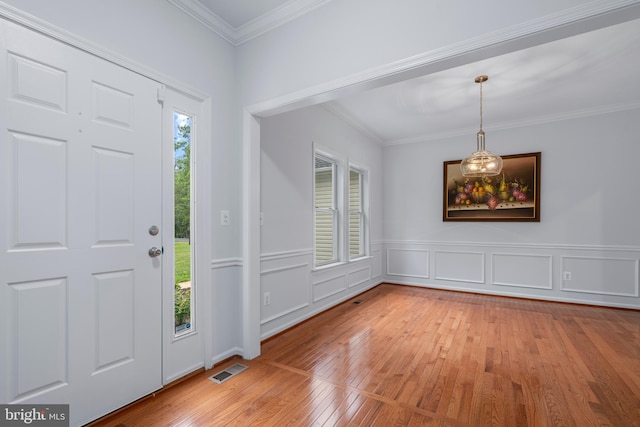 13647 Van Doren Rd, Manassas, VA 20112 - foyer with hardwood / wood-style flooring, crown molding, and wainscoting