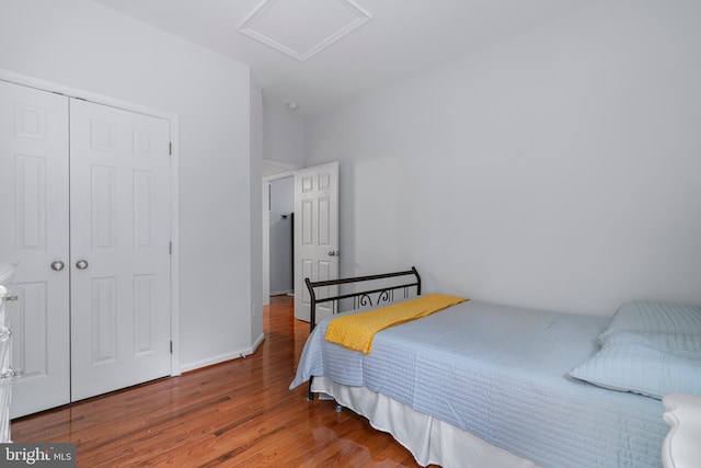 13647 Van Doren Rd, Manassas, VA 20112 - bedroom featuring attic access, wood finished floors, and a closet