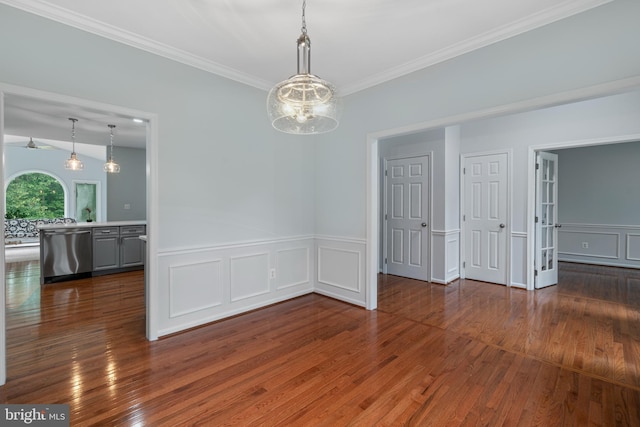 13647 Van Doren Rd, Manassas, VA 20112 - unfurnished room featuring wood-type flooring, ornamental molding, a decorative wall, a wainscoted wall, and a chandelier