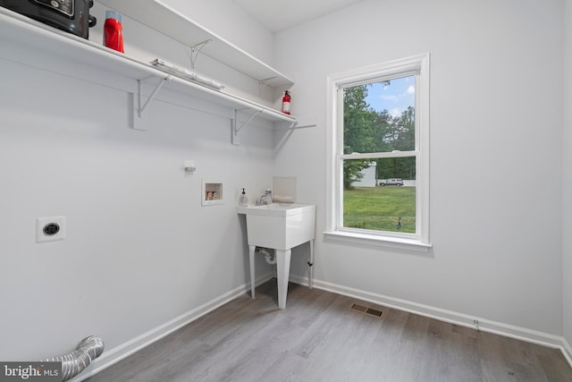 13647 Van Doren Rd, Manassas, VA 20112 - laundry area featuring hookup for an electric dryer, hookup for a washing machine, wood finished floors, and baseboards