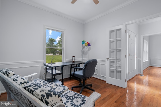 13647 Van Doren Rd, Manassas, VA 20112 - office with crown molding, wood finished floors, a ceiling fan, a decorative wall, and a wainscoted wall