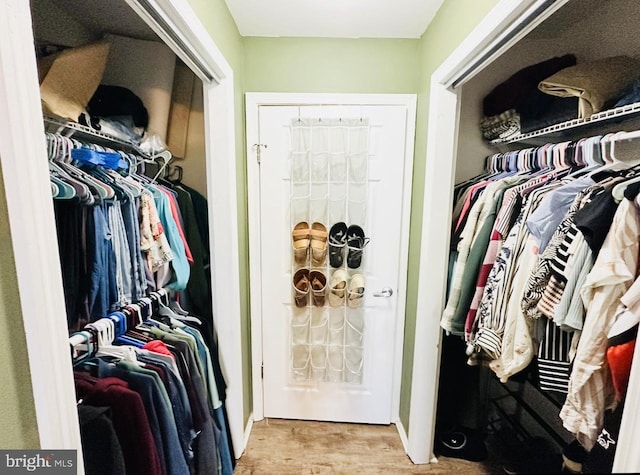 spacious closet featuring wood finished floors