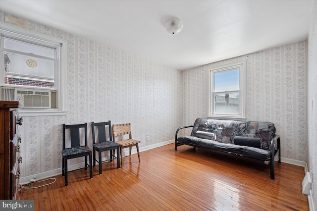 sitting room with cooling unit and hardwood / wood-style floors