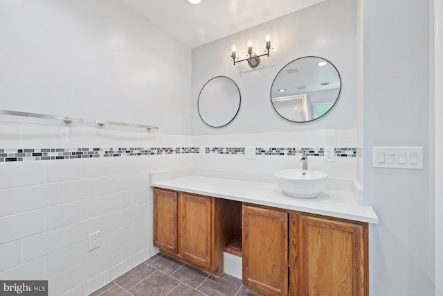 bathroom featuring tile walls, tile patterned flooring, and vanity