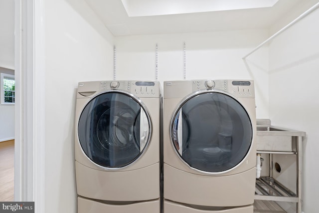 washroom with washer and dryer and laundry area