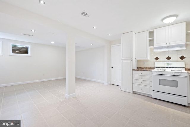 kitchen with decorative backsplash, open shelves, white cabinets, under cabinet range hood, and white range with gas stovetop