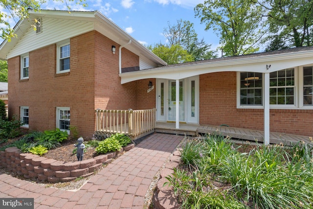 view of front facade featuring covered porch and brick siding
