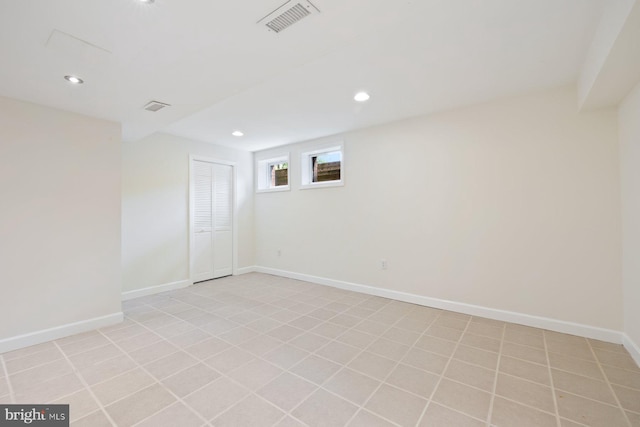 unfurnished room with baseboards, recessed lighting, and visible vents
