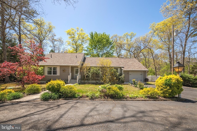 single story home featuring a garage
