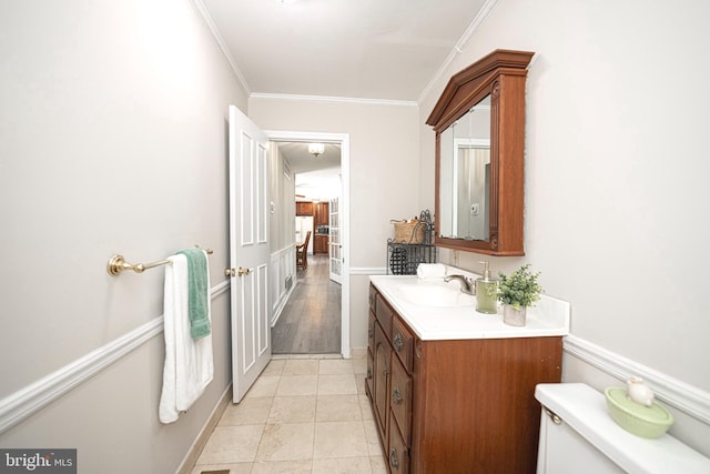 bathroom featuring ornamental molding and vanity