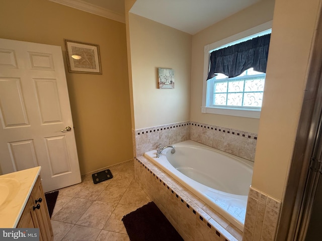 full bath featuring tile patterned floors, a garden tub, and vanity