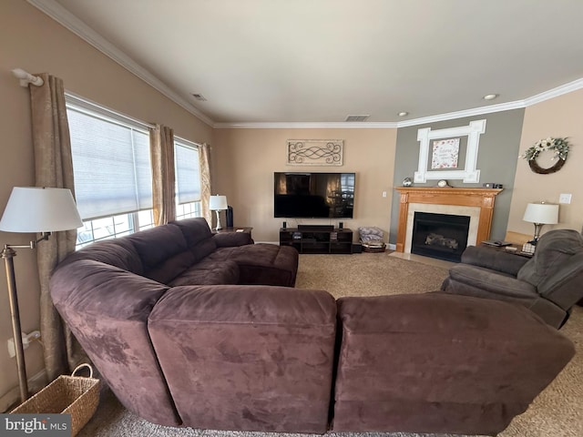 carpeted living area featuring visible vents, ornamental molding, and a fireplace with flush hearth