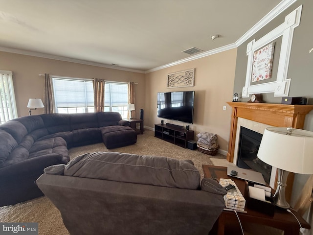 carpeted living room featuring visible vents, a fireplace with flush hearth, baseboards, and crown molding