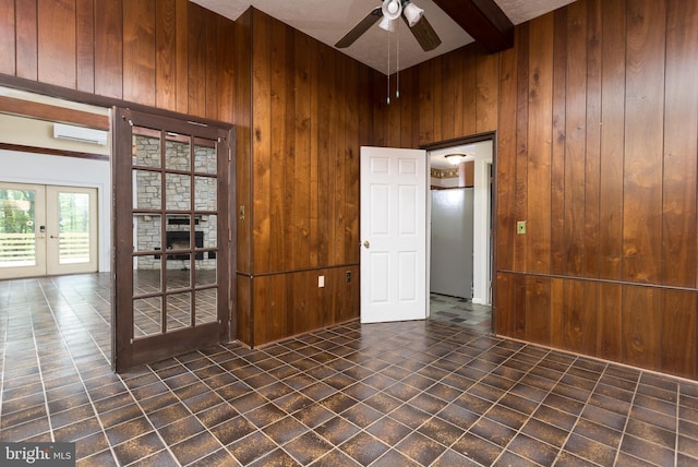 1738 Shanwick Rd, Forest Hill, MD 21050 - tiled empty room featuring french doors, a wall mounted air conditioner, wood walls, a ceiling fan, and beamed ceiling