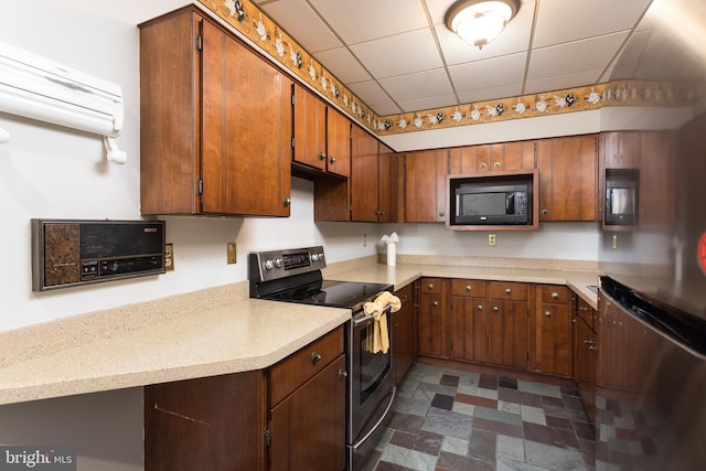 1738 Shanwick Rd, Forest Hill, MD 21050 - kitchen featuring electric range, black microwave, light countertops, freestanding refrigerator, and a paneled ceiling
