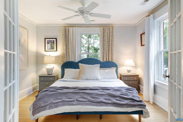 883 Locust Ave, Charlottesville, VA 22902 - bedroom with baseboards, light wood finished floors, crown molding, and visible vents