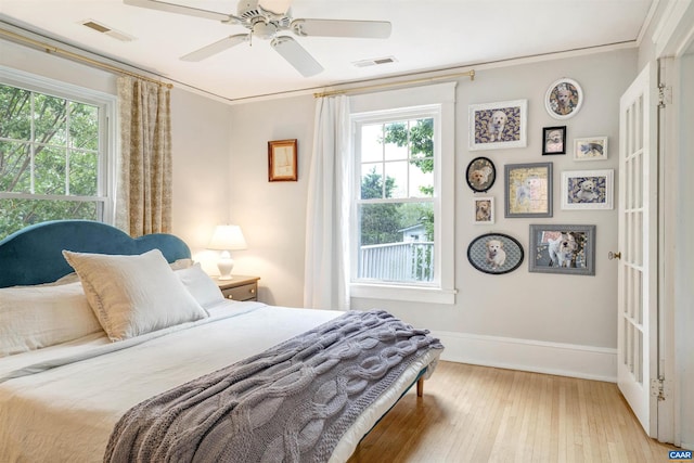 883 Locust Ave, Charlottesville, VA 22902 - bedroom with baseboards, visible vents, ceiling fan, and light wood-style floors