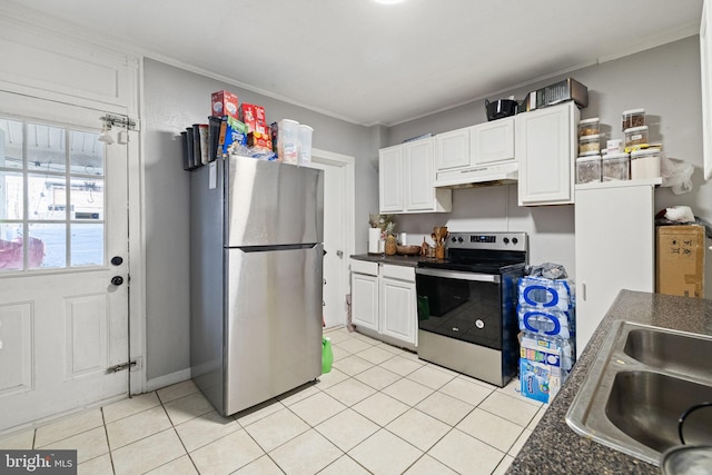 kitchen with light tile patterned flooring, appliances with stainless steel finishes, under cabinet range hood, and white cabinets