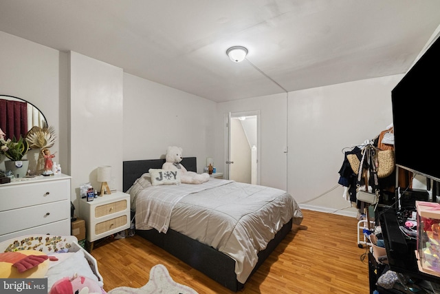 bedroom featuring light wood finished floors