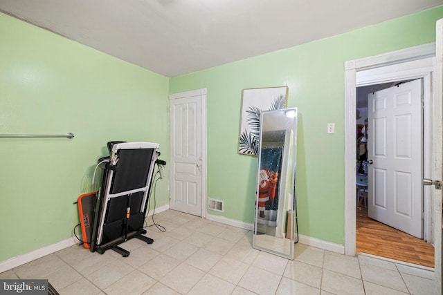 interior space featuring visible vents, baseboards, and light tile patterned floors