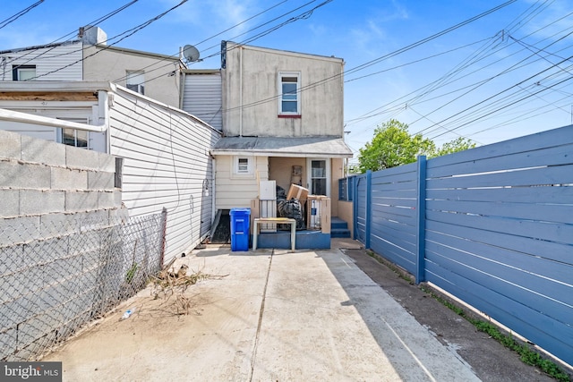 back of house featuring fence