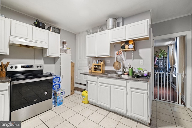 kitchen featuring dark countertops, a sink, electric stove, white cabinetry, and under cabinet range hood
