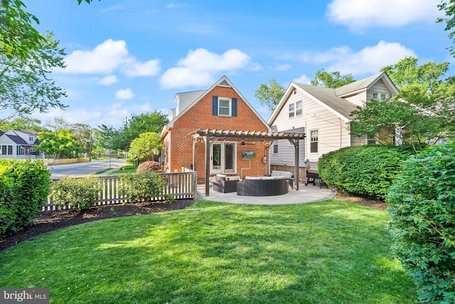 back of house featuring a pergola, outdoor lounge area, brick siding, and a patio
