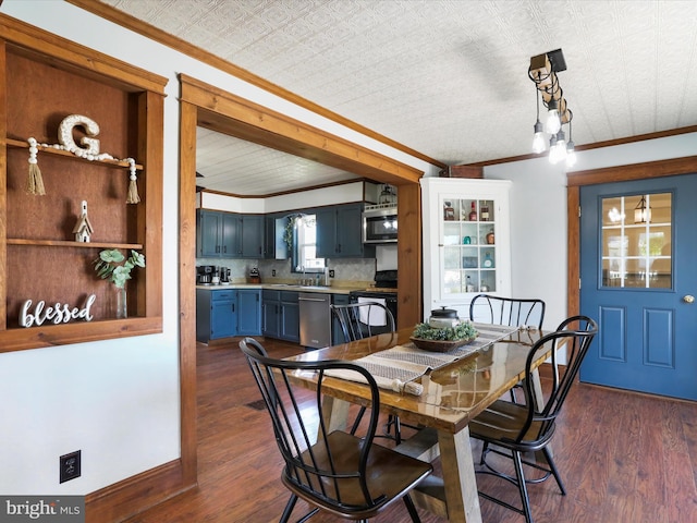 dining space featuring ornamental molding and dark wood-type flooring