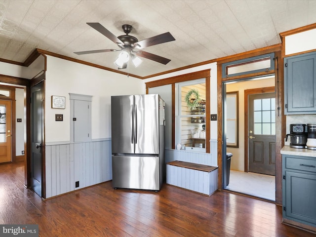 kitchen featuring ornamental molding, freestanding refrigerator, a ceiling fan, and dark wood-style flooring