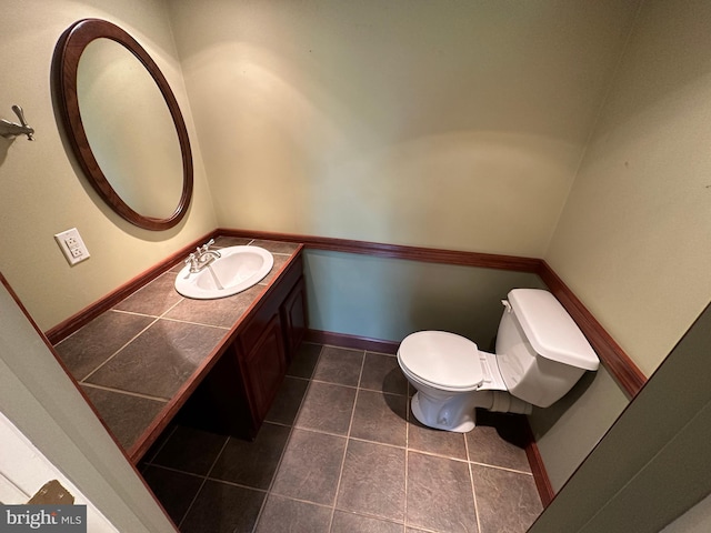15004 Burnt Mill Rd, Shippensburg, PA 17257 - bathroom with toilet, vanity, tile patterned flooring, and baseboards