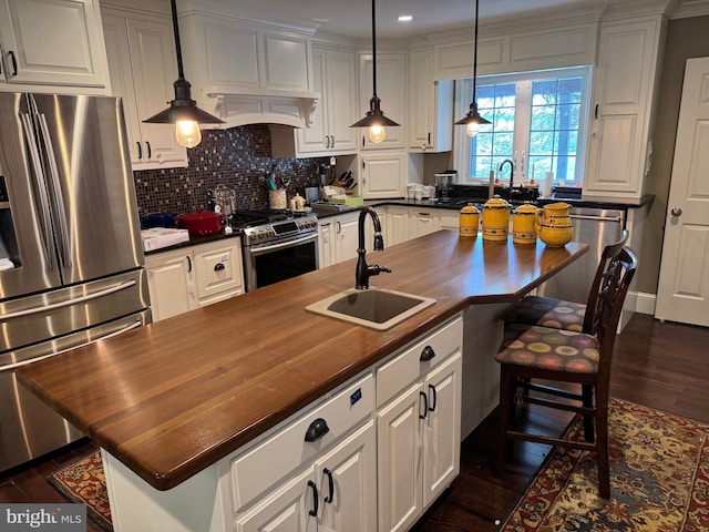 15004 Burnt Mill Rd, Shippensburg, PA 17257 - kitchen featuring stainless steel appliances, butcher block counters, a sink, white cabinets, and dark wood finished floors