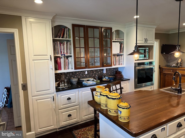 15004 Burnt Mill Rd, Shippensburg, PA 17257 - kitchen with stainless steel appliances, a sink, wood counters, white cabinetry, and ornamental molding