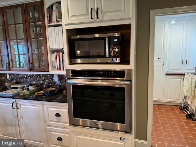 15004 Burnt Mill Rd, Shippensburg, PA 17257 - kitchen with stainless steel appliances, white cabinets, glass insert cabinets, and dark countertops