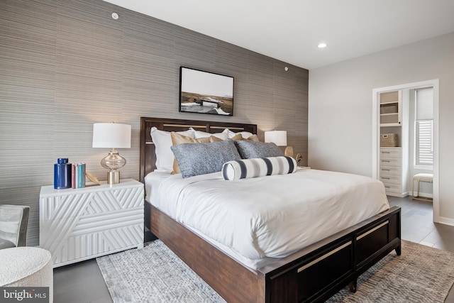 2001 Richmond St Unit 23B, Philadelphia, PA 19125 - bedroom with baseboards, an accent wall, and recessed lighting