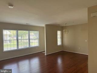 29 Avenrowe Ct, Fairless Hills, PA 19030 - unfurnished room with baseboards, wood finished floors, and a chandelier