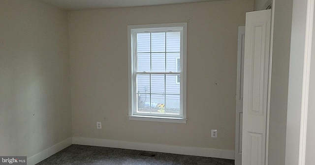 unfurnished room featuring baseboards and a healthy amount of sunlight